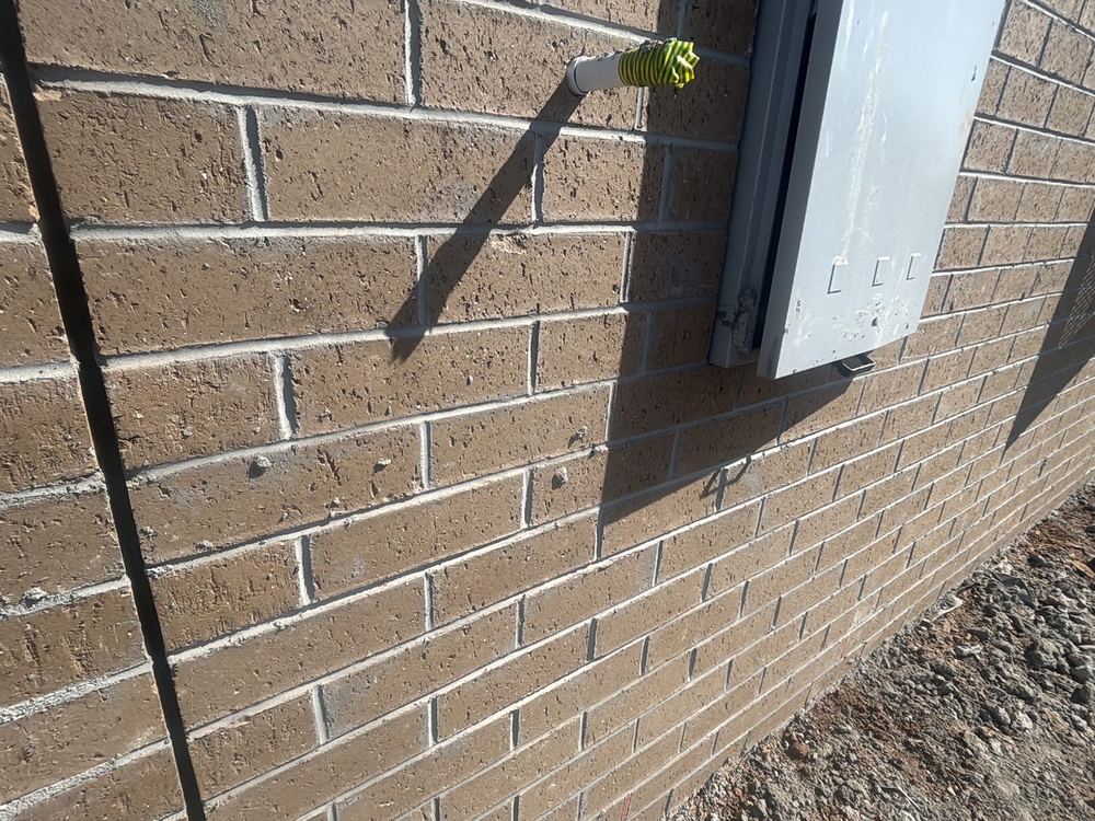 Mortar smears left across the face of the brickwork, found during a lock-up inspection in Tarneit