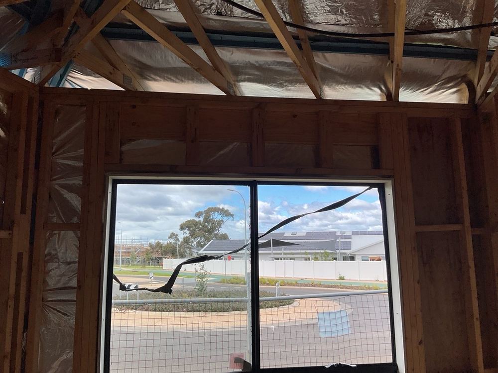 Lintel tie-down checked against the engineer's requirements for the span, found during a frame inspection in Tarneit